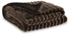 As cozy as they come, this faux fur throw turns your seating area into a haven of comfort. Its neutral hue acts as the perfect foundation for layering, whether mixed with pillows or draped over the arm of a sofa. And itâ€™s machine washable, so you can sp