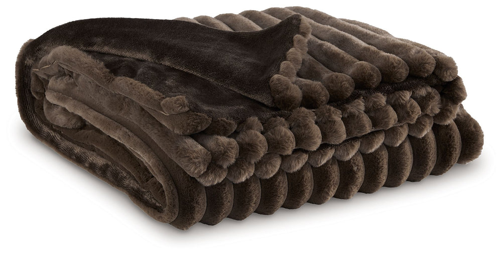As cozy as they come, this faux fur throw turns your seating area into a haven of comfort. Its neutral hue acts as the perfect foundation for layering, whether mixed with pillows or draped over the arm of a sofa. And itâ€™s machine washable, so you can sp