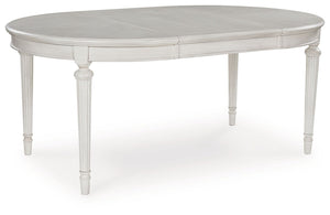 Transform your home into a haven of timeless elegance with this dining extension table. Traditionally styled, its classic antiqued white finish is paired with reeded legs and a tabletop with a butterfly-matched veneer pattern. With the removable center le