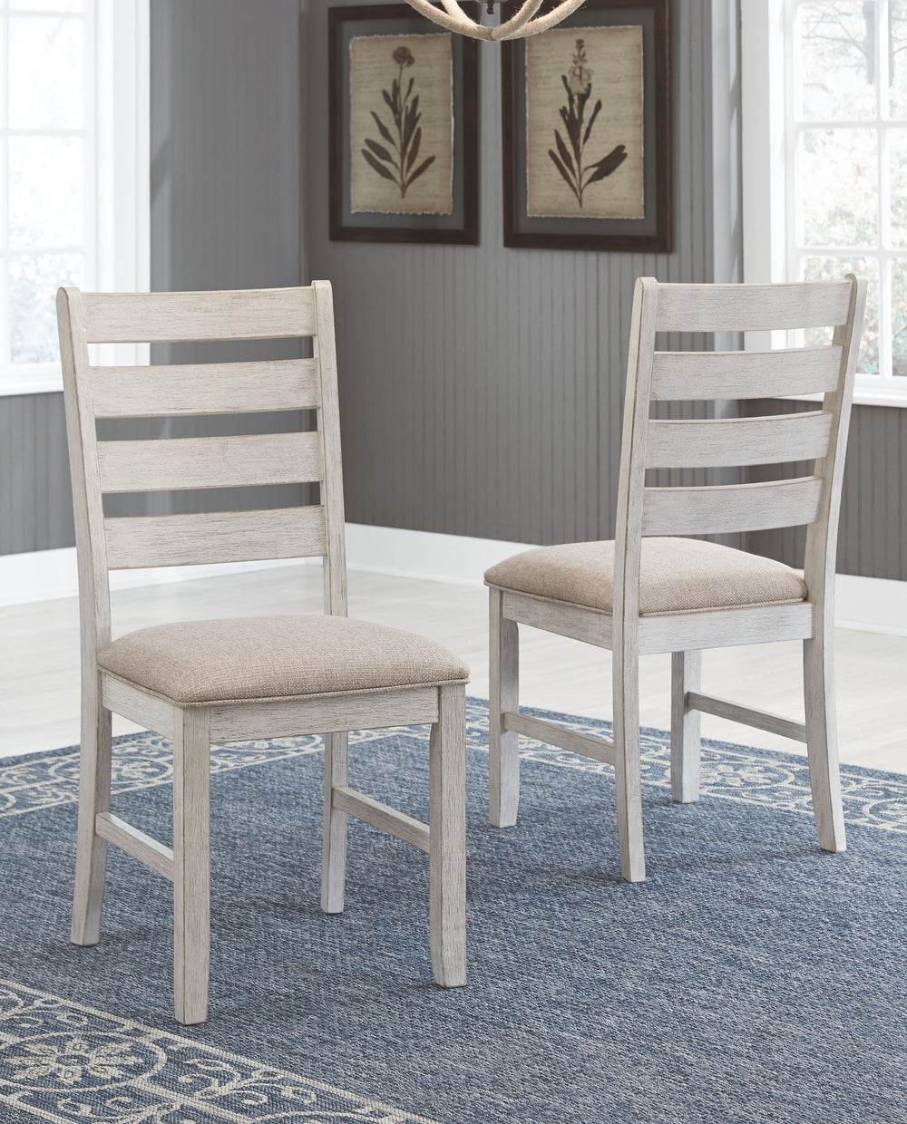 This dining chair invites you to raise the bar for small space living. An inspired choice for coastal chic or modern farmhouse settings, this comfortably cushioned chair sports a grayish white finish with rub through effect for timeworn appeal.<br><br><b>