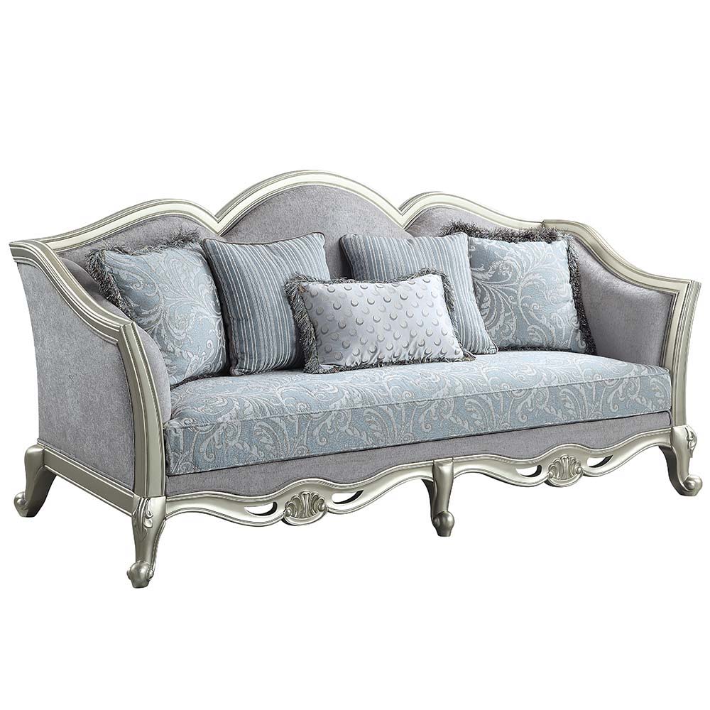 With a timeless silhouette influenced by French beauty, this Qunsia sofa makes a gracious statement in a comforting light gray linen upholstery fabric. Delicate curves invite the eye, while cabriole legs the champagne wooden trim that adds visual impact. 