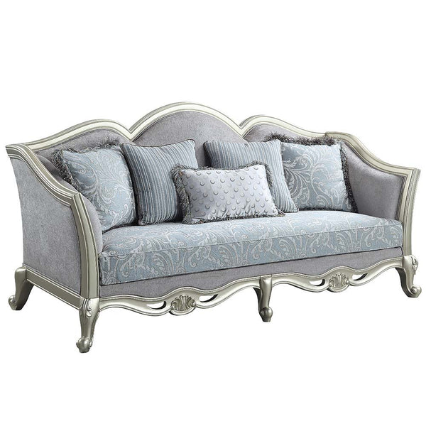 With a timeless silhouette influenced by French beauty, this Qunsia sofa makes a gracious statement in a comforting light gray linen upholstery fabric. Delicate curves invite the eye, while cabriole legs the champagne wooden trim that adds visual impact. 