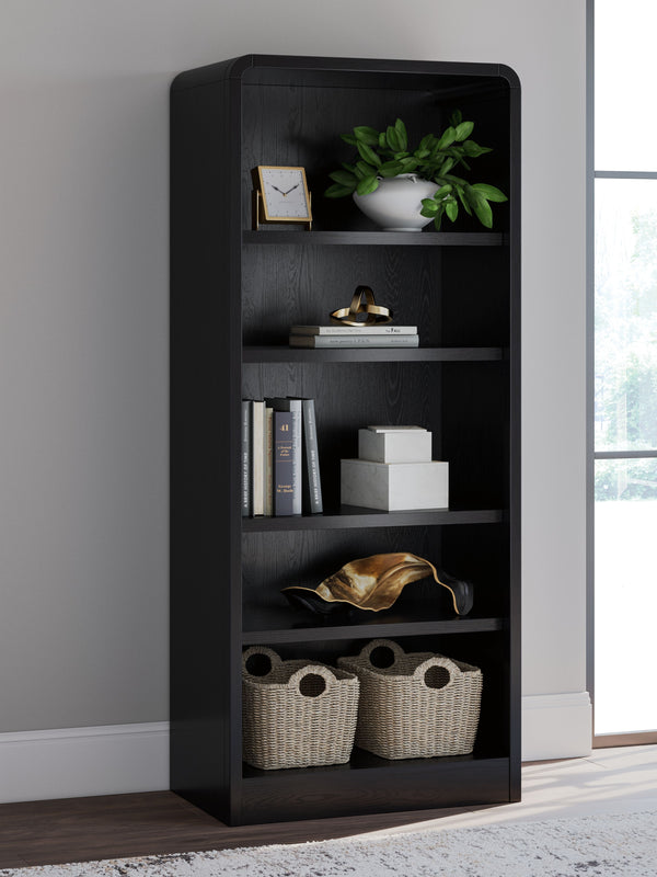  this softly shaped bookcase makes a lasting impression in a simply stunning way. Its magnificent curved silhouette is enhanced by a rich layered black finish on the textured wood grain surface. Complete with shelves to display