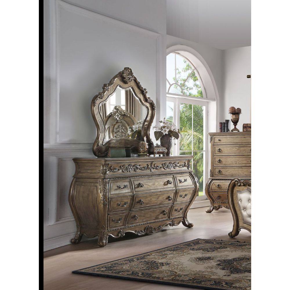 The Ragenardus dresser is an impeccable example of truly memorable luxurious traditional design. This eleven-drawer vintage oak dresser features a detailed French style front and English back in a stunning Bombay shape case, Felt-Lined top drawer, side me
