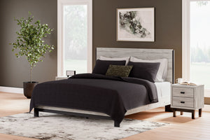  this two-toned king panel bed brings sleek style to your space. The sheer simplicity of its profile frames your mattress stunningly. With this chic 