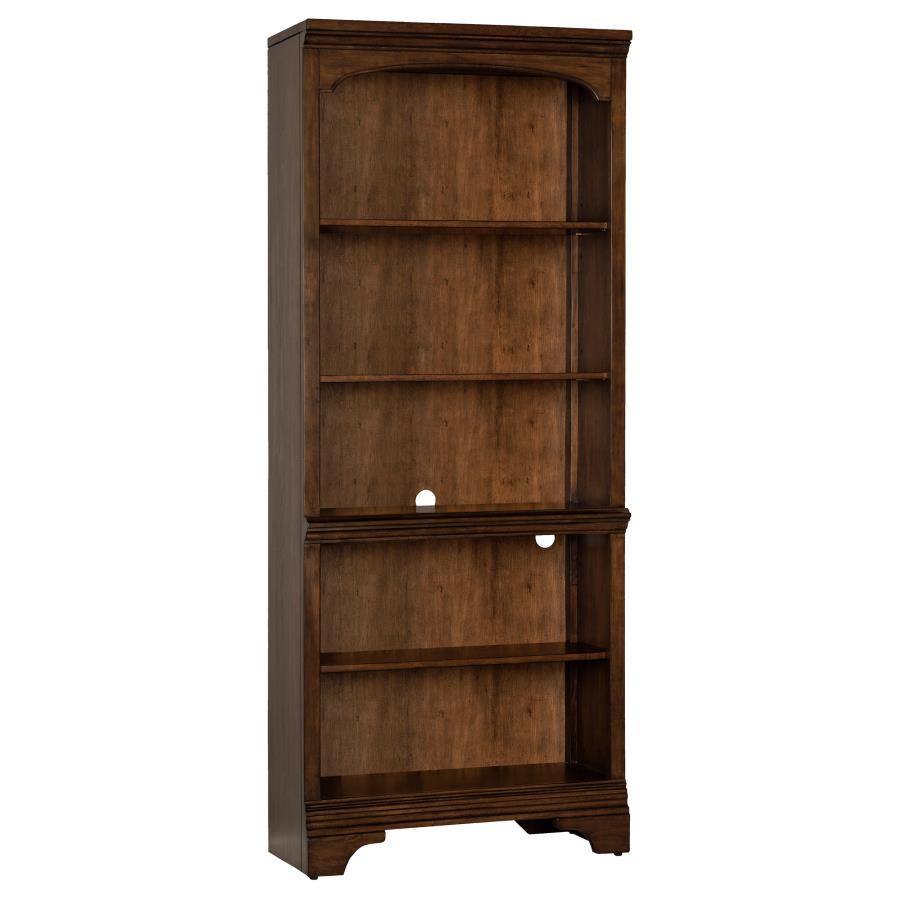 A traditional style bookcase is an elegant addition to offices and home libraries. This piece features five roomy shelves with plenty of space to arrange your favorite novels. Elegant detailing includes a stacked design on the top of the frame with a curv