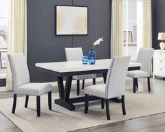 A fresh take on a traditional silhouette makes this group a great addition to your dining space. A faux marble top provides an elegant look while being easy to care for. The trestle base is updated in a contemporary charcoal finish. The upholstered dining