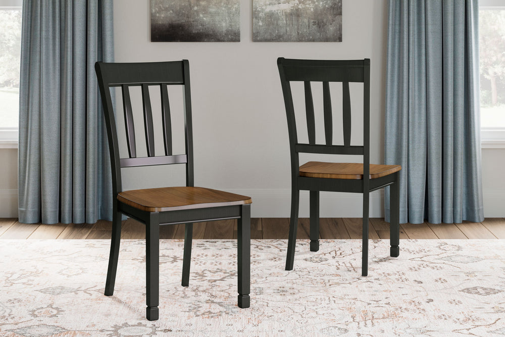 The classic slat back chair is more in style than everâ€”and doesnâ€™t this dining room side chair bring it back in brilliant fashion. It dons a subtle two-tone finish for a look thatâ€™s equally homey and sophisticated. Vintage inspiration at its best.<b