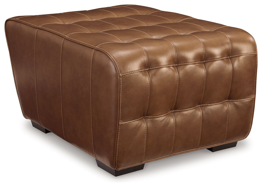 A mid-century modern update to a retro classic, this ottoman is generously adaptable. Its combination of skillfully matched leather and faux leather upholstery exudes luxury and elegance. The cushion-'s dramatic tufting beckons you to kick back and relax.