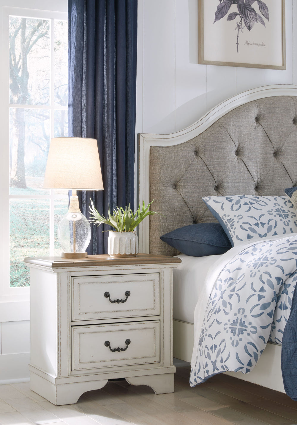 Traditional design. Casual appeal. You can have it all with this nightstand. A relaxed two-tone aesthetic merges with ornate profiled drawer fronts and pilasters to give the distinctive piece an allure all its own. Expansive drawers with quality dovetail 