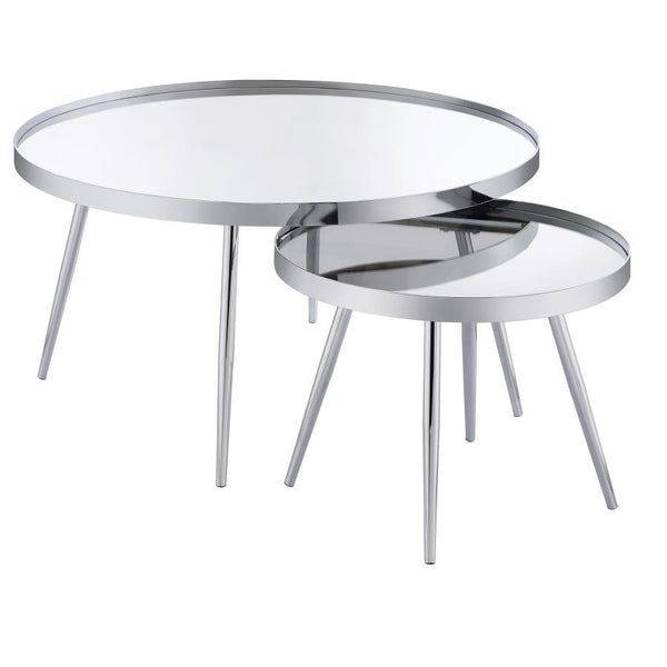 Sleek surfaces and clean lines bring all eyes to a pair of nesting coffee tables that brim with contemporary energy. The tables mirror one another in everything but size, with the smaller table tucking underneath its larger counterpart to conserve space o