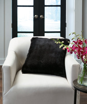  subtle and sensational. The plush feel of this faux rabbit fur pillow will drive you wild. Its black hue pairs with a variety of decor