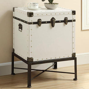  it features brushed brass nailhead accents for a touch of elegance. The sturdy metal base