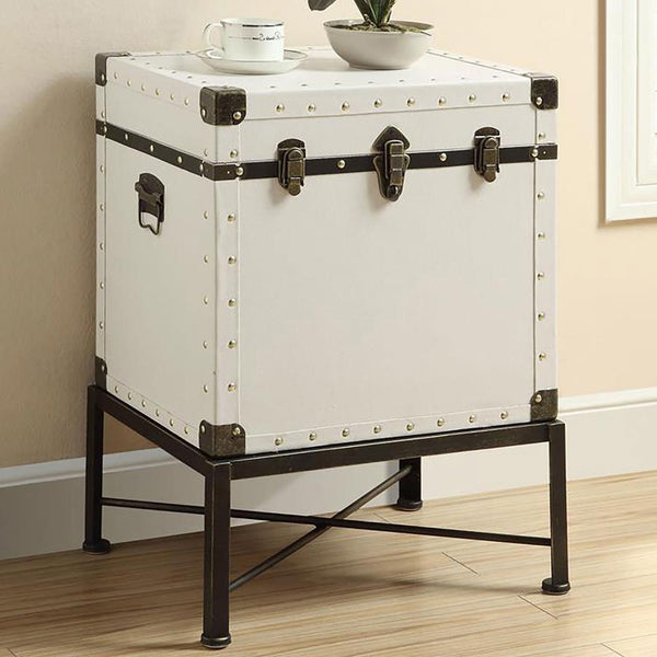  it features brushed brass nailhead accents for a touch of elegance. The sturdy metal base