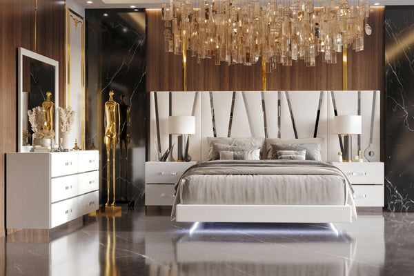 The Europa 7 Piece Bedroom Set in white seamlessly combines modern elegance with practical functionality. This comprehensive set includes a panel bed along with a dresser, mirror, two nightstands, and two nightstand back panels. The integrated headboard w