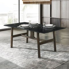 This dining set includes a rectangular table with a fixed top featuring sintered stone and tempered glass. The padded seat and back cushion chairs offer comfort and style. Complementing the set, the two-tone server boasts metal side glide drawers with 2/3