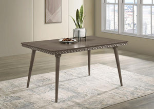  adding a textural contrast to the smooth tabletop. Constructed with a blend of solid wood