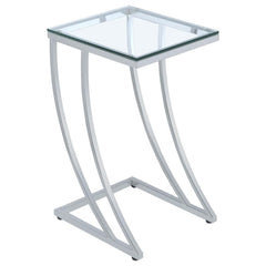 Elevate your space with this stylish side table, featuring a clear tempered glass top that blends sleek modernity with durability. The gracefully curved metal frame in an electroplated chrome finish adds sophistication and strength, making it a standout a
