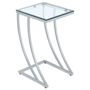 Elevate your space with this stylish side table, featuring a clear tempered glass top that blends sleek modernity with durability. The gracefully curved metal frame in an electroplated chrome finish adds sophistication and strength, making it a standout a