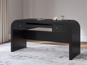  this softly shaped home office desk makes a lasting impression in a simply stunning way. Its magnificent curved silhouette is enhanced by a rich layered black finish on the textured wood grain surface. Complete with ample stor