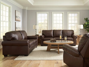 Sporting traditional elements including a roll arm frame with nailhead trim, this set provides here-and-now relevance. Mix in this combination of comfort and affordable luxury for a look youâ€™ll love for years to come. <h4><b>Colleton - Dark Brown - Sofa