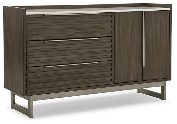 Clean lines lend sophistication and structure to this dresser. Its complex rich grayish brown finish contrasts perfectly with a white marble top, while the streamlined silhouette features overlay slats to create visual interest. A metal base and bar pulls