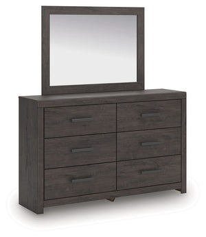 Designed with everyday style in mind, this dresser with mirror is a simply chic approach to modern living. A dark charcoal finish blends black and brown undertones, creating a versatile look that effortlessly pairs with your existing pieces. And for must-