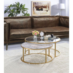 Entertain in style with the Shanish Coffee Table Set. This distinctive two-piece occasional table set showcases intertwining tables with a gold finished metal base that nestles together or can separate for additional entertainment and display space. This 