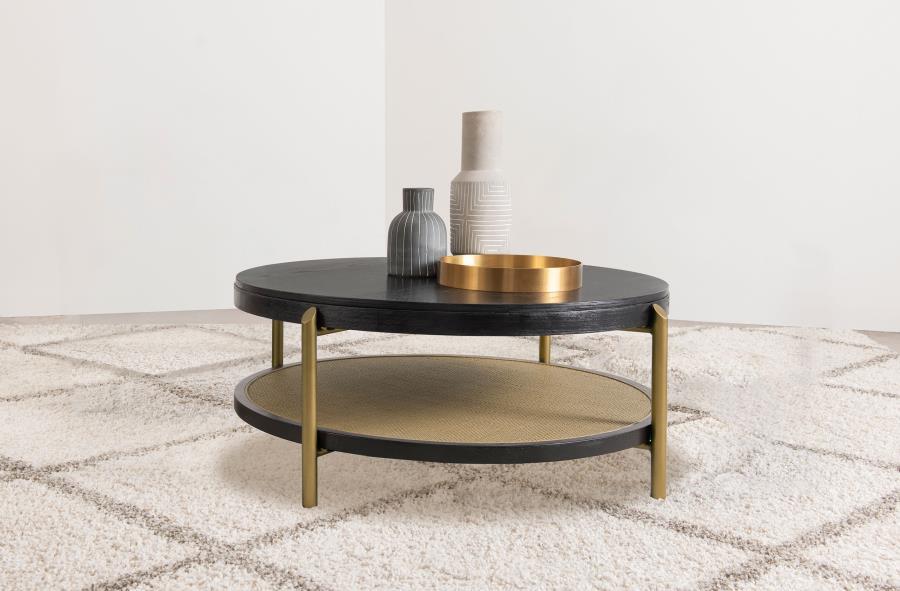 This round coffee table combines modern design with rustic charm, perfect for todayâ€™s living spaces. Crafted with Asian hardwood, engineered wood, and ash veneer, its smooth finish highlights the natural wood grain for an organic appeal. The lower shelf