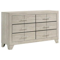 This six-drawer dresser combines modern style with a rustic edge, creating the perfect balance of elegance and functionality for your bedroom. With a rustic cream finish over rough-sawn, white-washed engineered paper veneer, it exudes a warm yet contempor