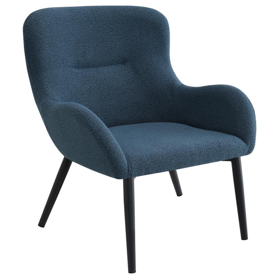 Add a touch of color to your living room seating ensemble with a modern accent armchair. Its inviting silhouette boasts prominent curves, with a rounded back and flared arms. A single line of tufting adds dimensionality to the look, while plush foam cushi