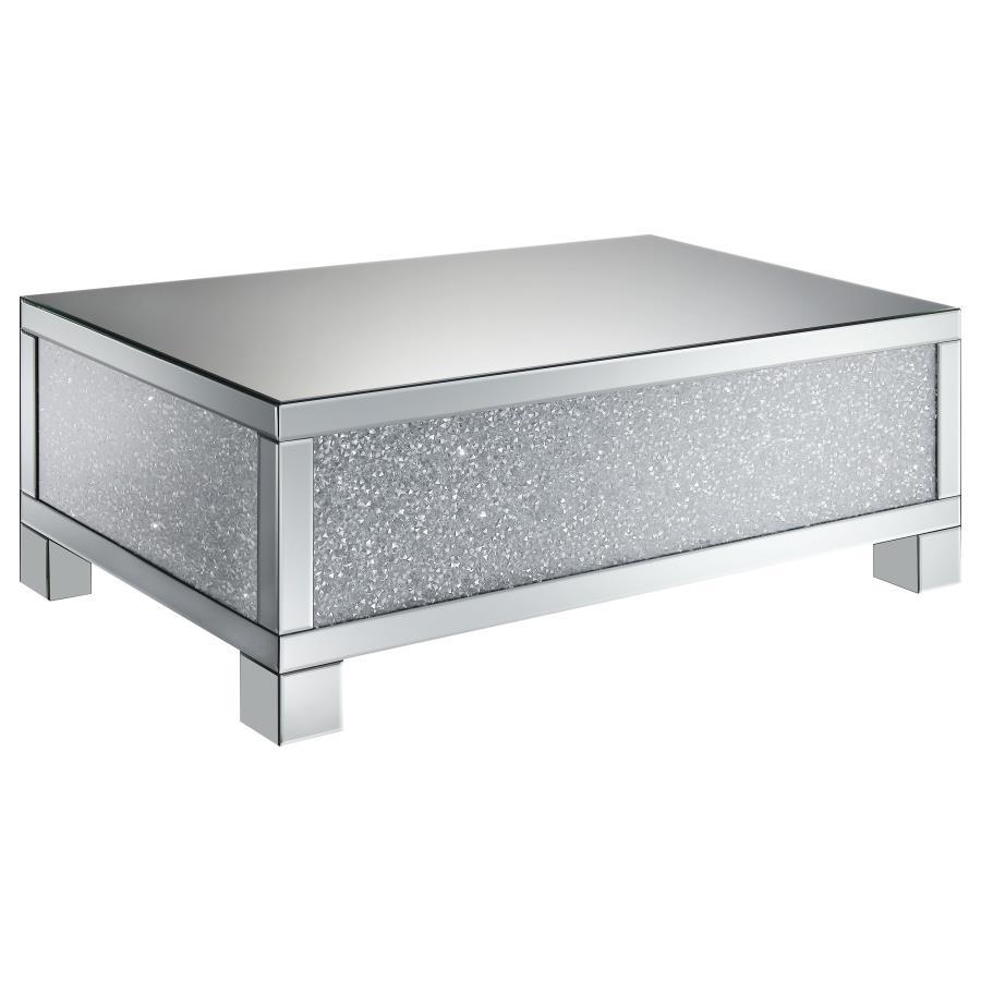 This 48-inch rectangular mirrored coffee table is the perfect centerpiece for a glam living room. Designed with an engineered wood frame, it features fully mirrored surfaces that reflect light beautifully, while acrylic crystal accents provide dazzling sp