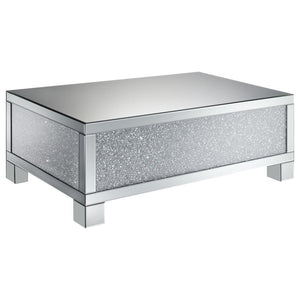 This 48-inch rectangular mirrored coffee table is the perfect centerpiece for a glam living room. Designed with an engineered wood frame, it features fully mirrored surfaces that reflect light beautifully, while acrylic crystal accents provide dazzling sp