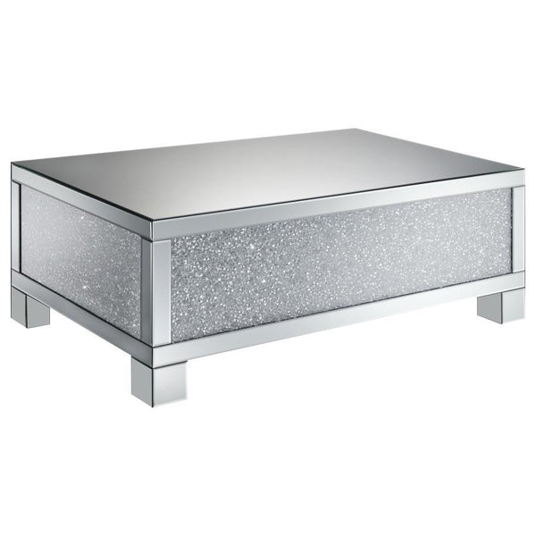 This 48-inch rectangular mirrored coffee table is the perfect centerpiece for a glam living room. Designed with an engineered wood frame, it features fully mirrored surfaces that reflect light beautifully, while acrylic crystal accents provide dazzling sp