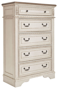 Elevating the art of traditional cottage styling, this chest of drawers is your dream bedroom retreat realized. Its antiqued two-tone aesthetic blends a chipped white with a distressed wood finished top for added charm. Framed drawer fronts and decorative
