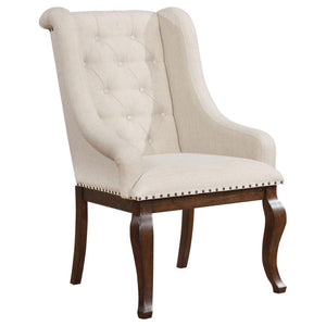  the chair features sloping arms that draw the eye and offer superb comfort and support. Its button tufted back lends classic style. Nailhead trim creat