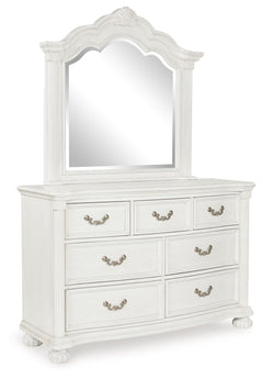 Transform your inner sanctum into a haven of timeless elegance and functionality. This traditionally styled dresser with mirror is adorned in a classic antiqued white finish, highlighted by a serpentine-shaped front with thick decorative moulding. Its dra