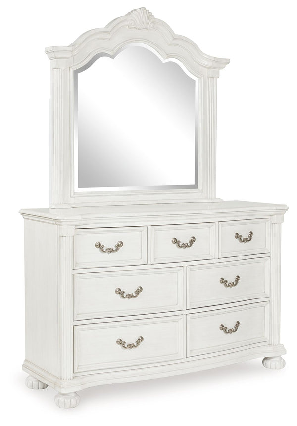 Transform your inner sanctum into a haven of timeless elegance and functionality. This traditionally styled dresser with mirror is adorned in a classic antiqued white finish, highlighted by a serpentine-shaped front with thick decorative moulding. Its dra