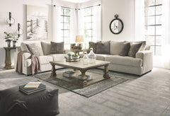 Everyone can have the best seat in the house with this sofa and loveseat. An indulgent choice with deep seats crafted for cloud-like softness, this set is the ideal merger of modern flair and classic staying power. <h4><b>Soletren - Stone - Sofa</b></h4> 