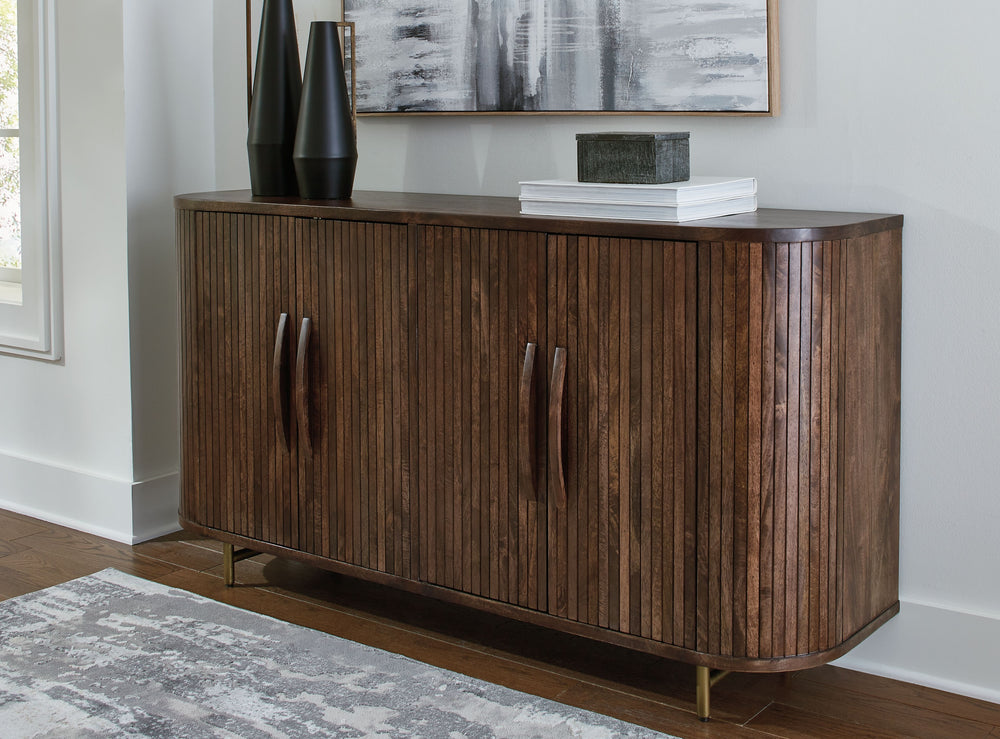 Function and style merge perfectly with this accent cabinet. Exquisitely crafted with mango wood, it makes a great case for refined contemporary design. Adding to its allure, the fluted door fronts and gracefully curved side detail keep the look cool with