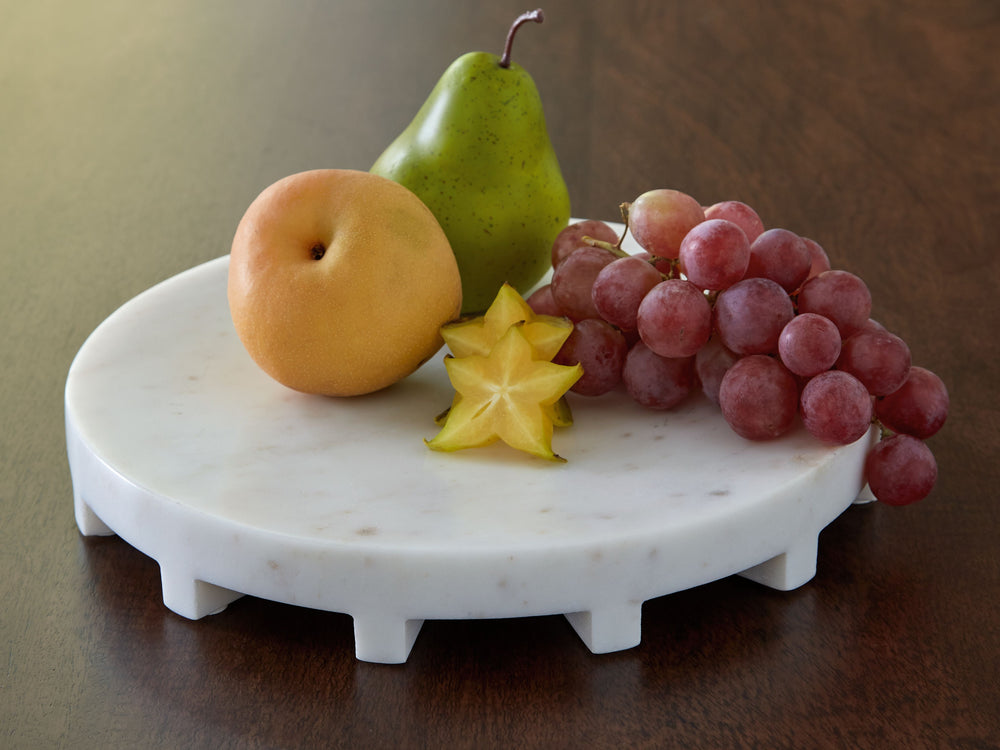 Elevated entertaining. This tray is the perfect platform for hosting snacks, apps and more. Crafted in an elegant white marble, it-'s an ultra-chic addition to kitchen counters and dining tables when you need to serve food in style. In between events, the