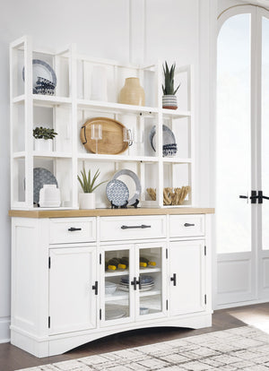 This server and hutch delivers casual style with substance. A classic white finish and butcher block oak veneer top add a relaxed vibe to a delicious design that exudes a modern farmhouse aesthetic. Cabinets, drawers and open shelves provide ample storage