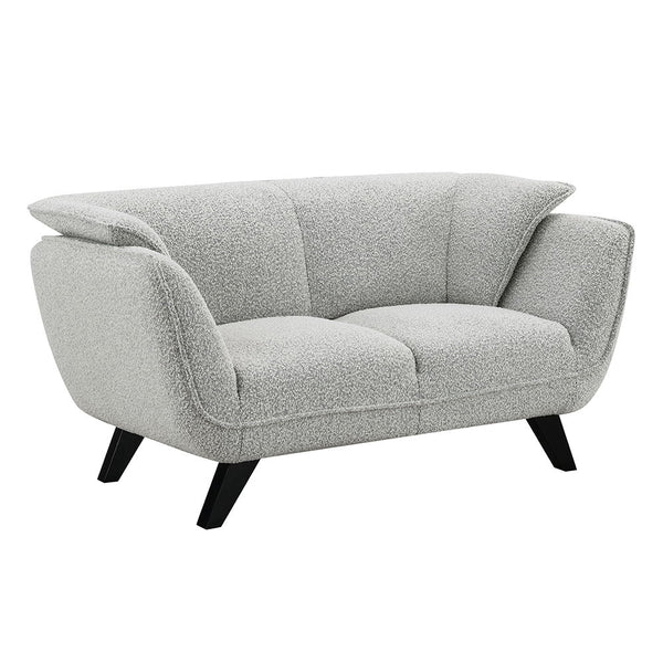  draped in light gray fabric. Accompanied by plush pillows