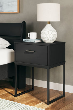 this nightstand is inspired by chic design. A matte black finish and dark pewter-tone handles offer an elegant touch to this so-cool piece. It beautifully blends the hues of natural living with the edginess of your modern lifestyle.<br/