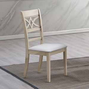 Ferris dining table boasts an antique gray finish exuding timeless elegance. The set includes chairs with intricately designed backs and padded seat cushions, ensuring comfort and style for your dining experience. Perfect for both casual meals and formal 