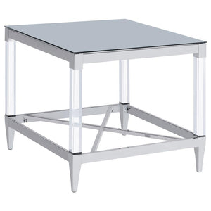 Gracing the side of your favorite armchair, this end table is a masterpiece of reflective beauty and modern design. The mirrored tempered glass top offers a dynamic surface that reflects light and life around it. Clear acrylic leg posts provide a sense of