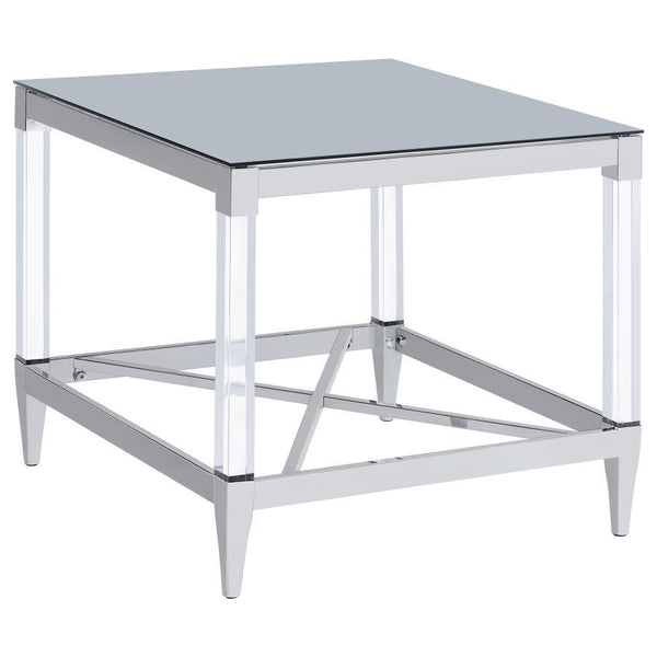 Gracing the side of your favorite armchair, this end table is a masterpiece of reflective beauty and modern design. The mirrored tempered glass top offers a dynamic surface that reflects light and life around it. Clear acrylic leg posts provide a sense of