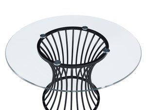  featuring a sculptural black metal base that adds an artistic flair and a se
