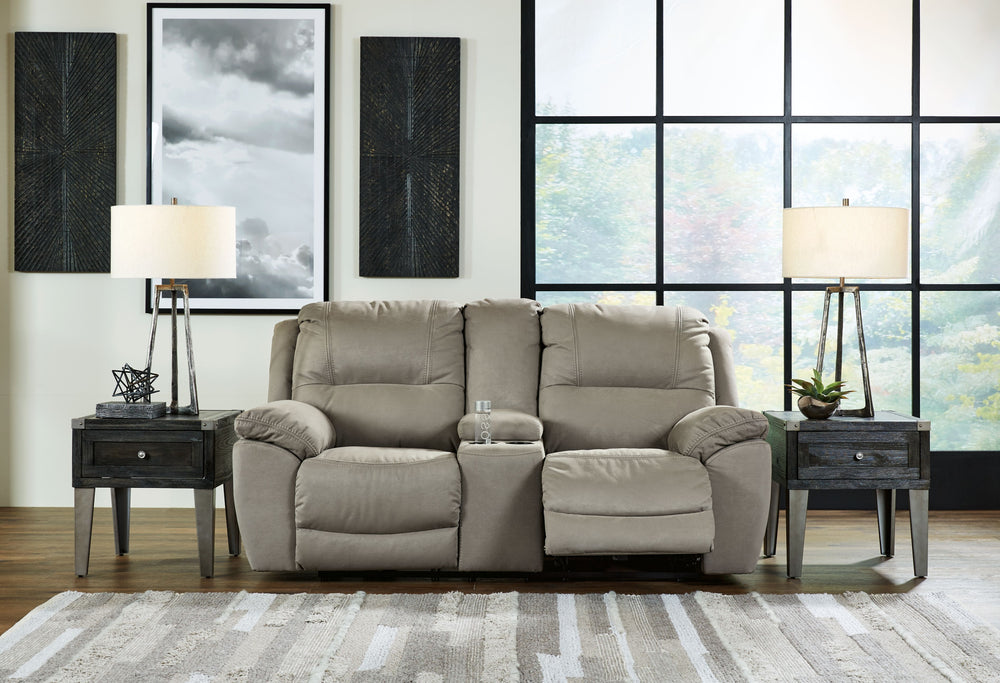 Kick back, relax, and enjoy some sports on TV with this reclining loveseat. You will love its double stuffed pillow top arms and soft-as-suede faux leather upholstery. The family-friendly dark gray color and creative stitching add panache. Recline in comf