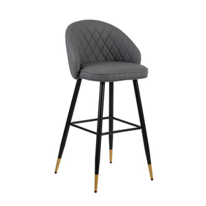 The Oliver Gray faux Leather Bar Stool set combines contemporary style with practical features to enhance any modern space. Each set includes two bar chairs with a sleek, arched back and low profile, offering a chic yet refined aesthetic. Crafted from eco